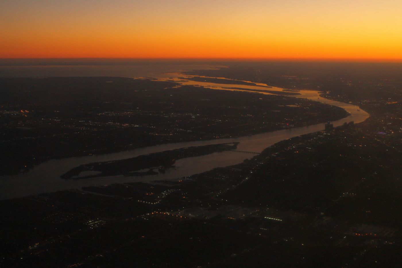 Detroit River and Belle Isle from the air at sunset
